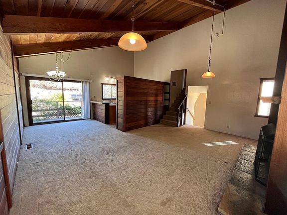 Living room facing dining & kitchen area.