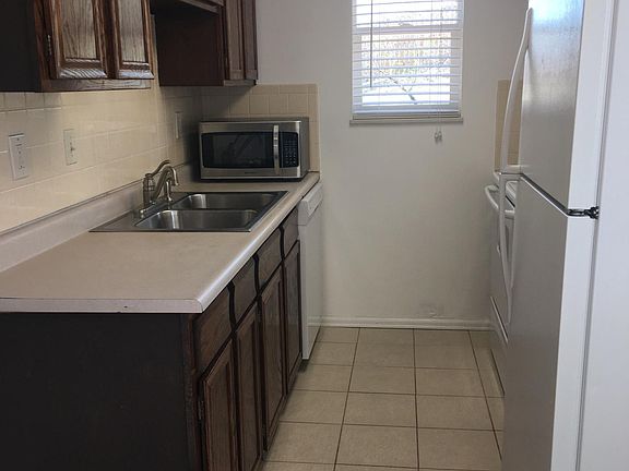 kitchen: dishwasher, garbage disposal and microwave.