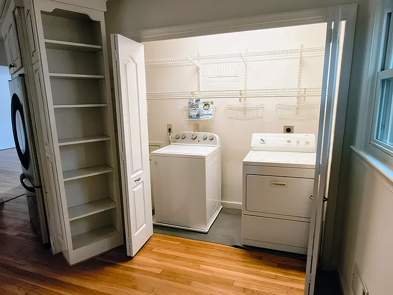 The laundry machine and dryer - gas - are in-suite, located to the side of the kitchen.