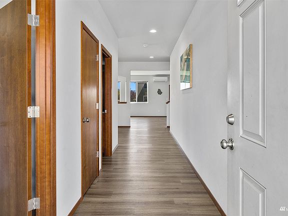 View as you enter into the front door,  down wide hall way. First door on the left is main floor bedroom, next is hall closet and then main floor restroom. Then it opens up to huge dining room and great room/kitchen area. >