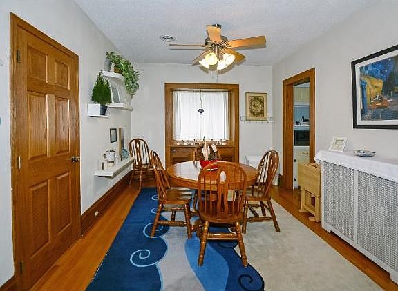 DINING/LIVING ROOM, BEAUTIFUL HARDWOOD FLOORS & UPDATED LIGHTING THROUGH OUT ENTIRE HOME!