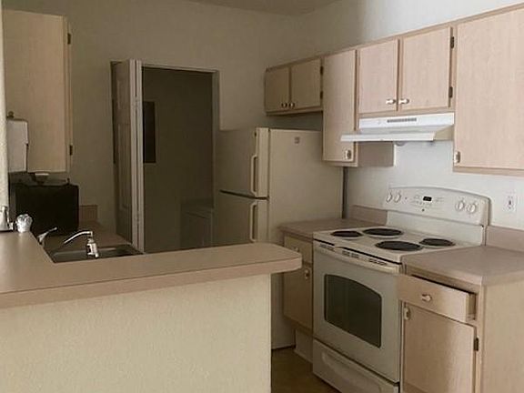 Kitchen with full size washer and dryer closet