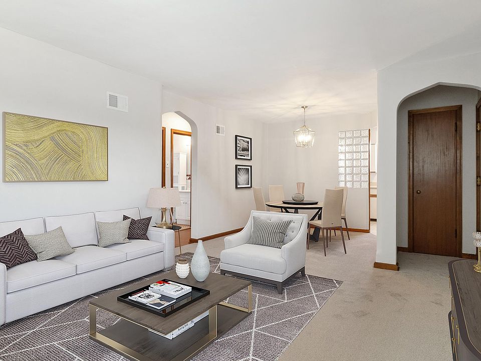 Open and airy space flows from living room to dining room. Brand-new carpet.