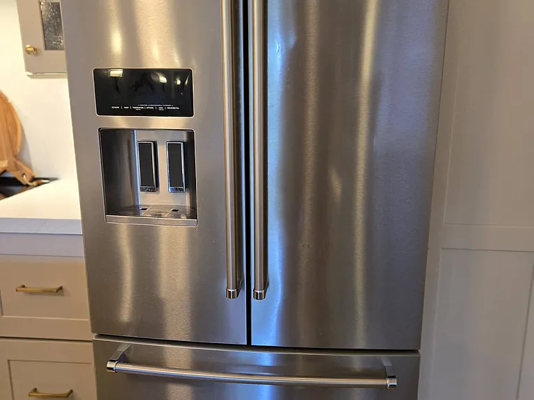 New stainless steel KitchenAid refrigerator and bottom pull-out freezer with no-fingerprint feature