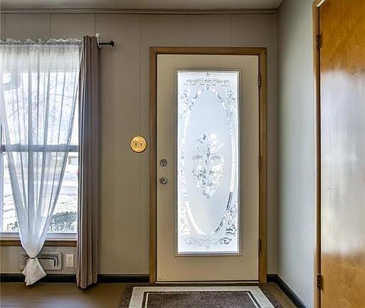 Etched glass front door welcomes you at the entry.