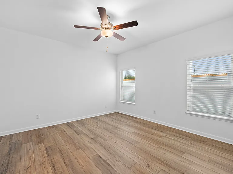 Two windows in the master bedroom.