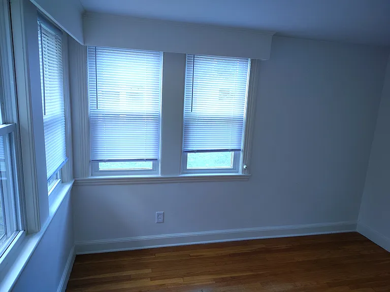 Second bedroom showing back and side windows.