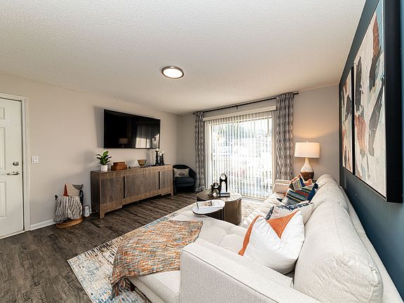 Spacious living room with hardwood-style flooring