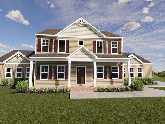 Two-story house in Scotchtown Estates with gable roof, beige siding, and front porch under a clear b