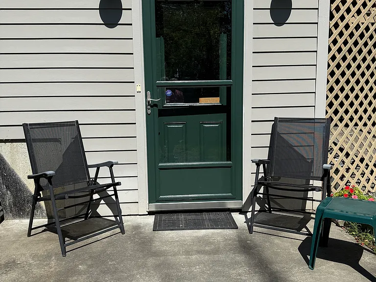 Private front entrance with patio for relaxing in the sun.