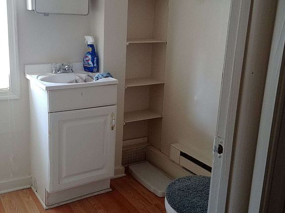 Full bath with tub and plenty of storage space
