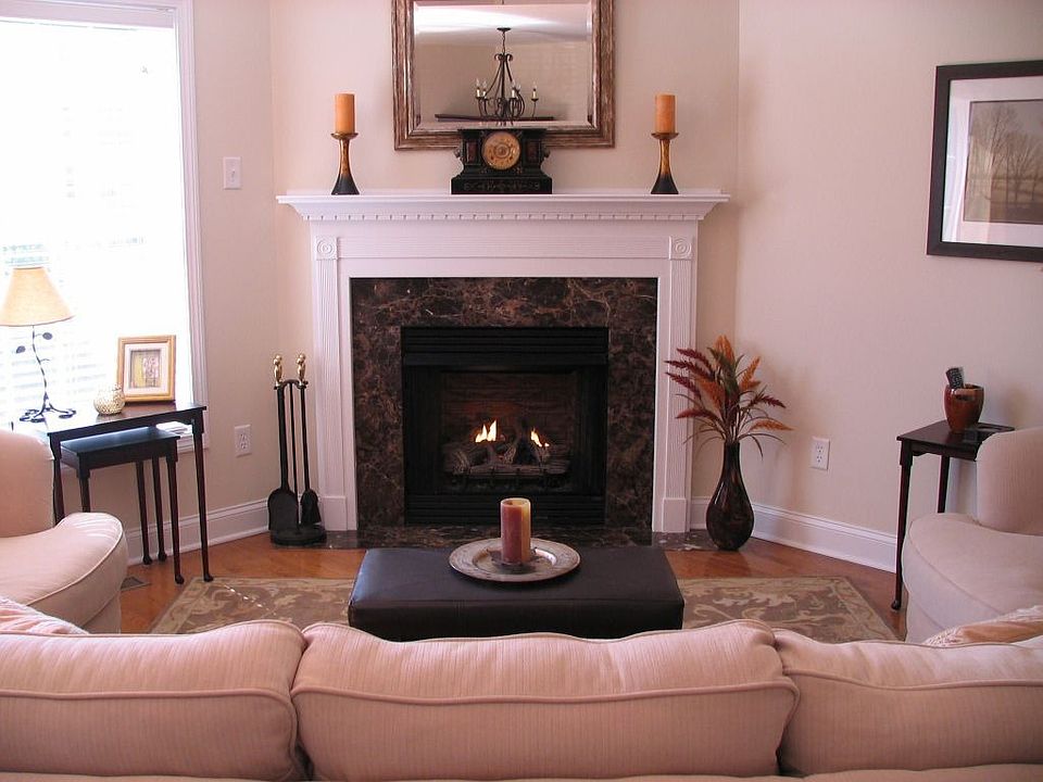 cozy livingroom with recessed lighting and slider to deck