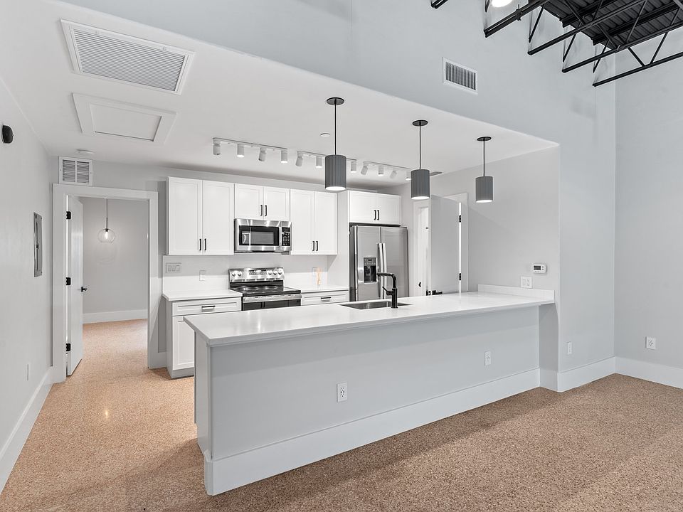 The exposed 12' ceiling in the living room is a stunning feature.