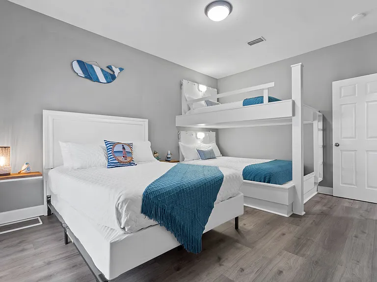 3rd bedroom bunkroom. 2 queen beds and 1 full bed.