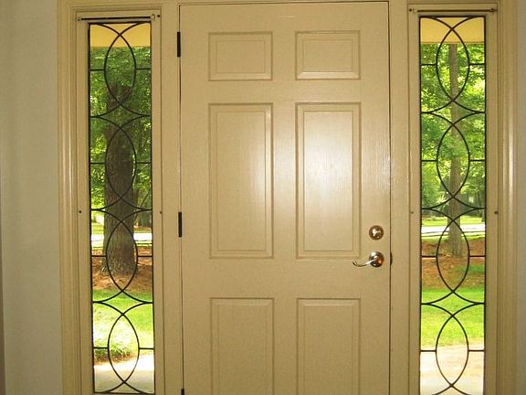 Entry foyer with leaded glass side panels