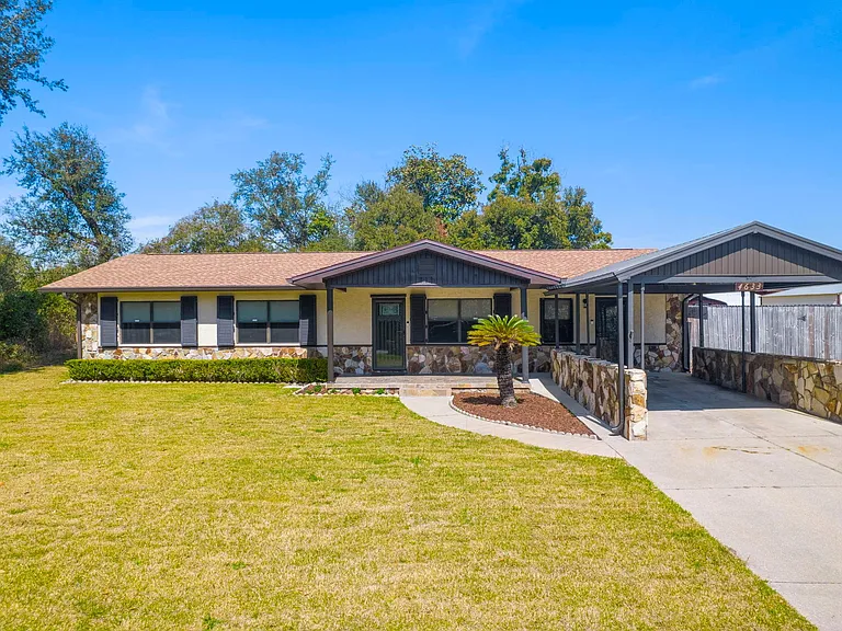 Fully remodeled home, inside and out. Ample parking, including a parking pad for a small boat or jet skis behind the gate to the right of the carport.