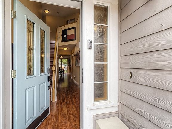 Covered front porch welcome with a cheery front door!