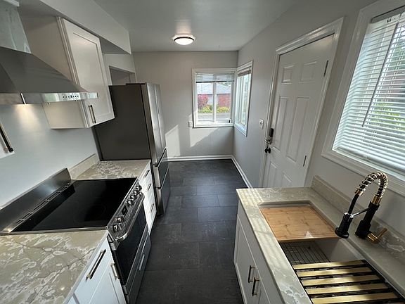 Completely remodeled kitchen with new soft close cabinets and drawers, new flat top stove and convection oven, new 4 door fridge/freezer, new multi work station sink, beautiful quartz countertops, etc.