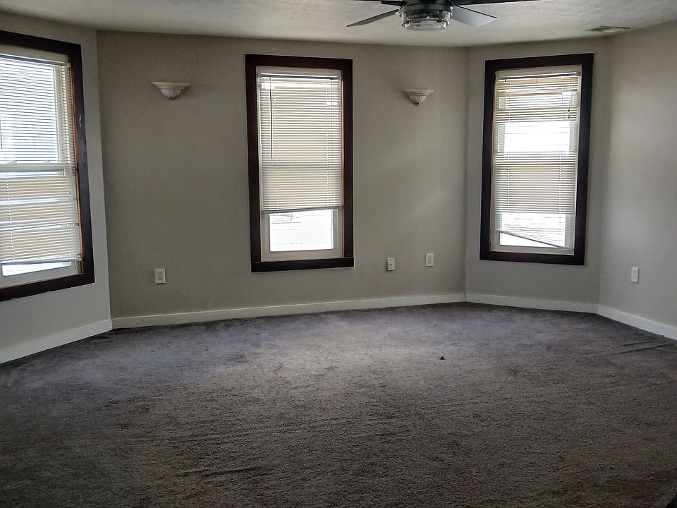 Living room with ceiling fan.