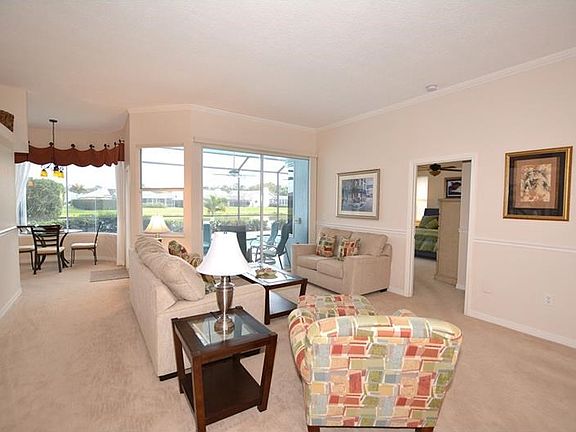 The formal living area is conveniently located off the kitchen and offers easy access to the outdoors.  Nice flow for entertaining.