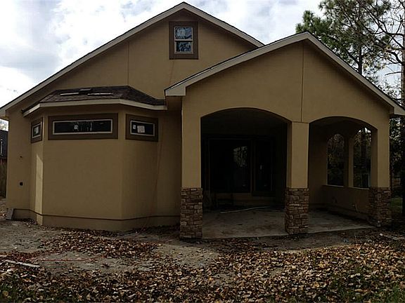 Rear of Home from back fence. Lots of room for pool and notice large patio. Outdoor Shower to left side of this photo
