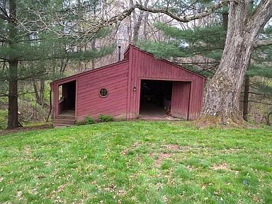 Nust see in this barn to see how large it is. There is a  front office area. Loads of storage and two doors that swing in. There is a trap door to small basement for storage as well