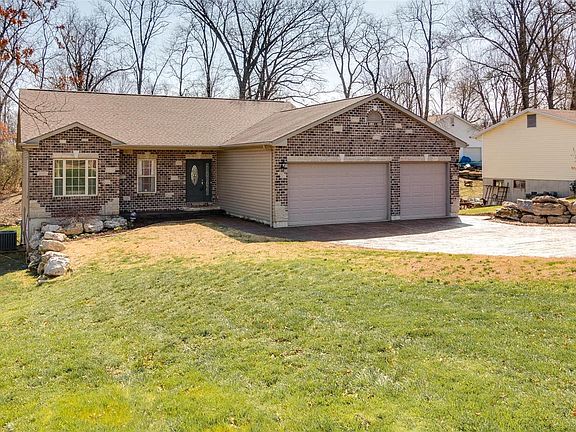 Custom built Great Room Ranch with Brick & Stone Facade