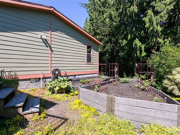 Sunny space for gardening. Newer hardiplank siding on the house!