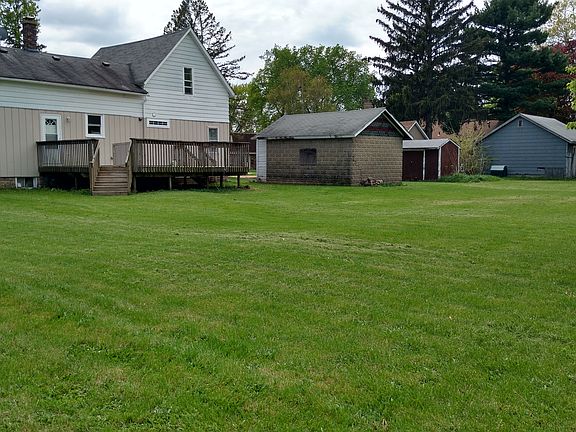 house, 2 garages, shed, 