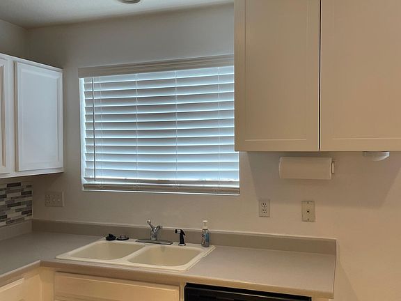 Sink, storage, and dishwasher.