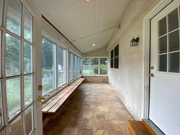 Entry way into Sunroom with functional windows
