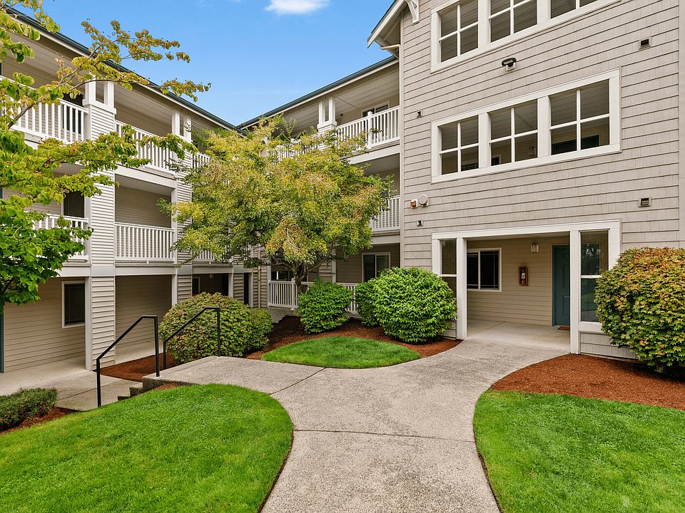 A welcoming courtyard setting with lush landscaping and direct access to your home.