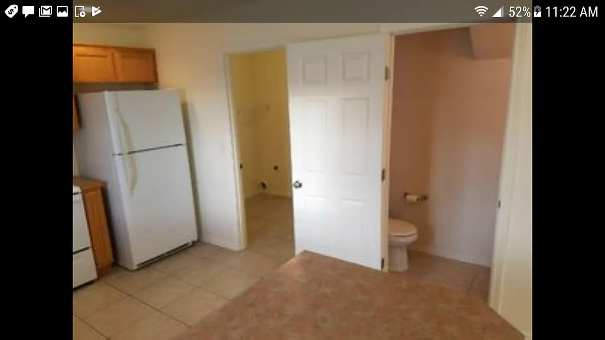 Large tile floored kitchen with utility laundry , room , washer and dryer and bathroom - 470 Laguna Dr #A