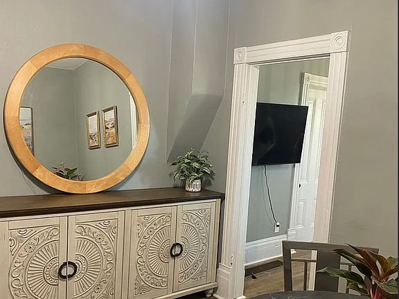 Large credenza has excellent extra storage for kitchenware and dining linens.