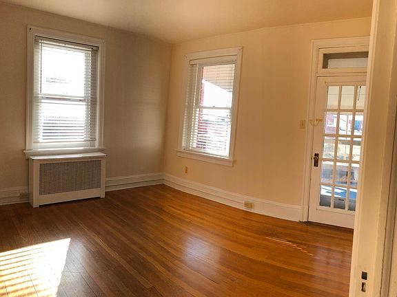 Living room with door to covered porch