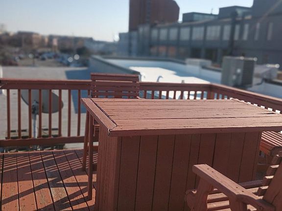 Rooftop deck. Furniture shown is no longer there.
