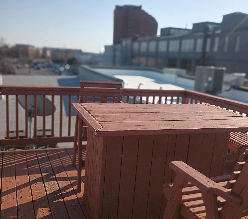 Rooftop deck. Furniture shown is no longer there.