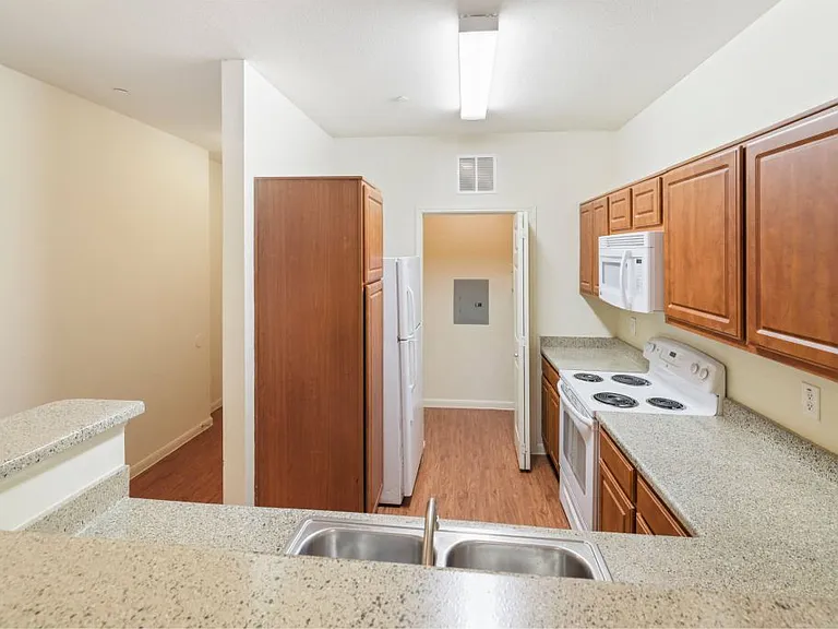 Open concept kitchen with plenty of counter space at Stonehaven Apartments in Houston, TX
