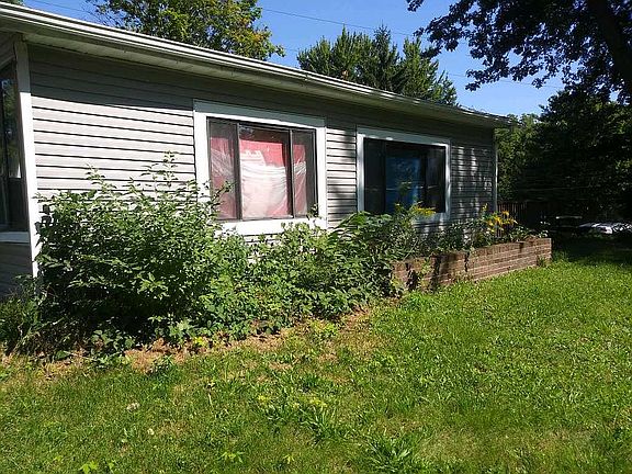 Front with brick flower bed