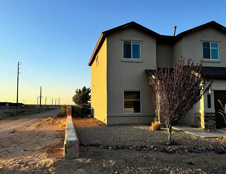 showing west side of the house. also showing no neighbors here and immediate entrance to the desert for endless riding.