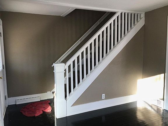 Living room w/beautiful stair case