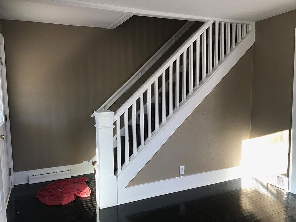 Living room w/beautiful stair case