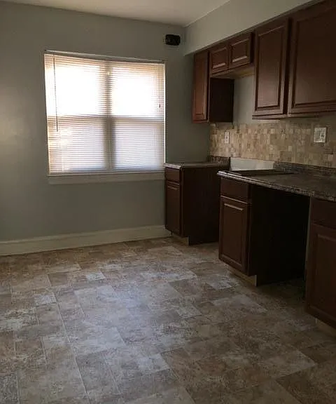 Third bedroom upstairs. used to be Kitchen and has lots of cabinets and a sink.