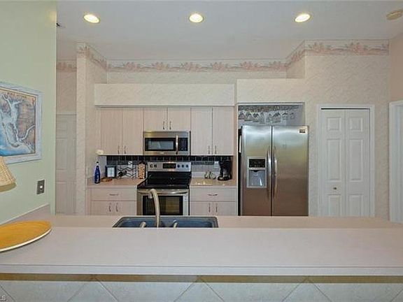 Kitchen with contractor's upgrades: cabinetry and floors