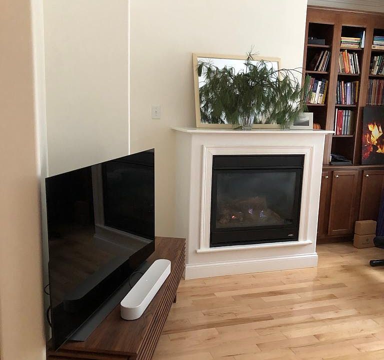Living room has a gas fireplace