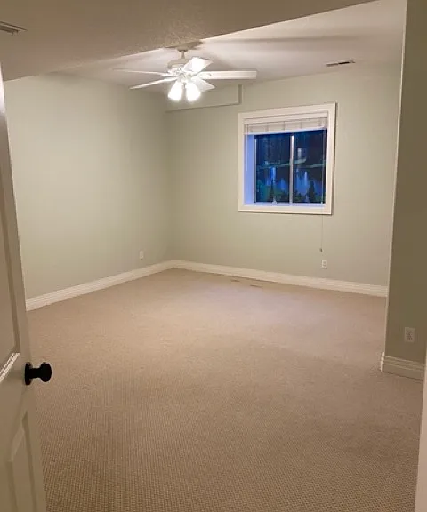 Spacious bedroom with natural light, 8 ft ceilings