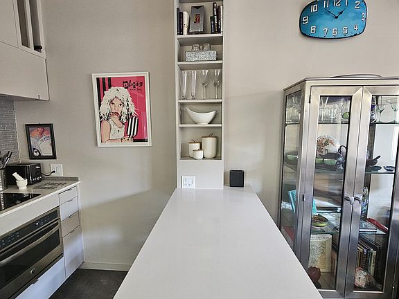 Dining peninsula can seat up to 4. Quartz countertops.