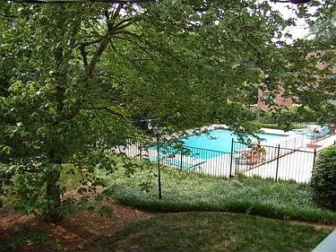 Terrific location in community overlooking pool