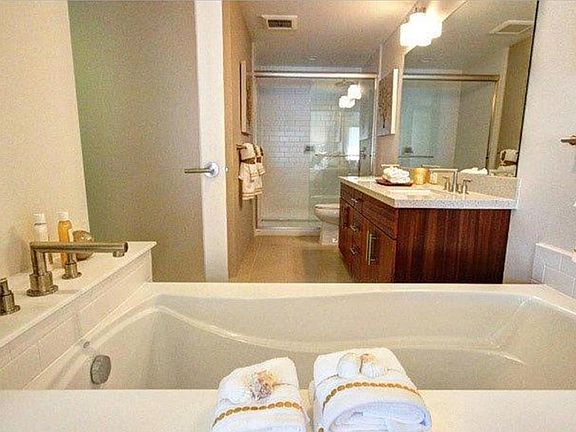Masterbath with luxurious tub and peekaboo shutters