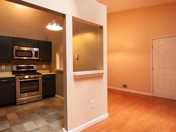 open concept space for kitchen, dining, and living rooms